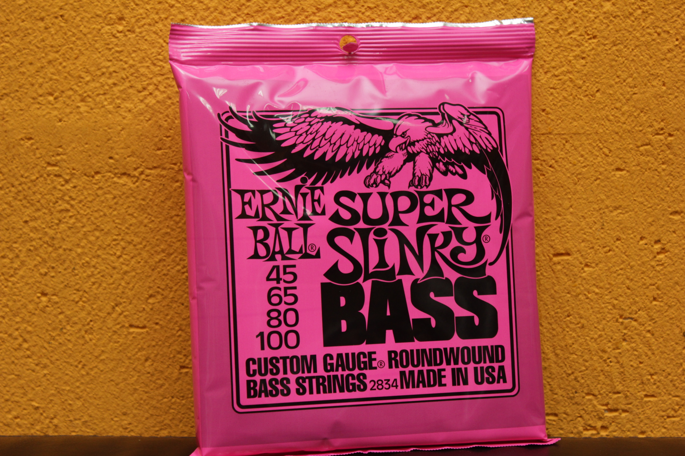 Ernie ball slinky. Струны Ernie Ball 2834. Ernie Ball 45 100. Ernie Ball 2844. Струны Ernie Ball 2844.